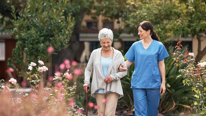 Healthcare assistant with a senior man